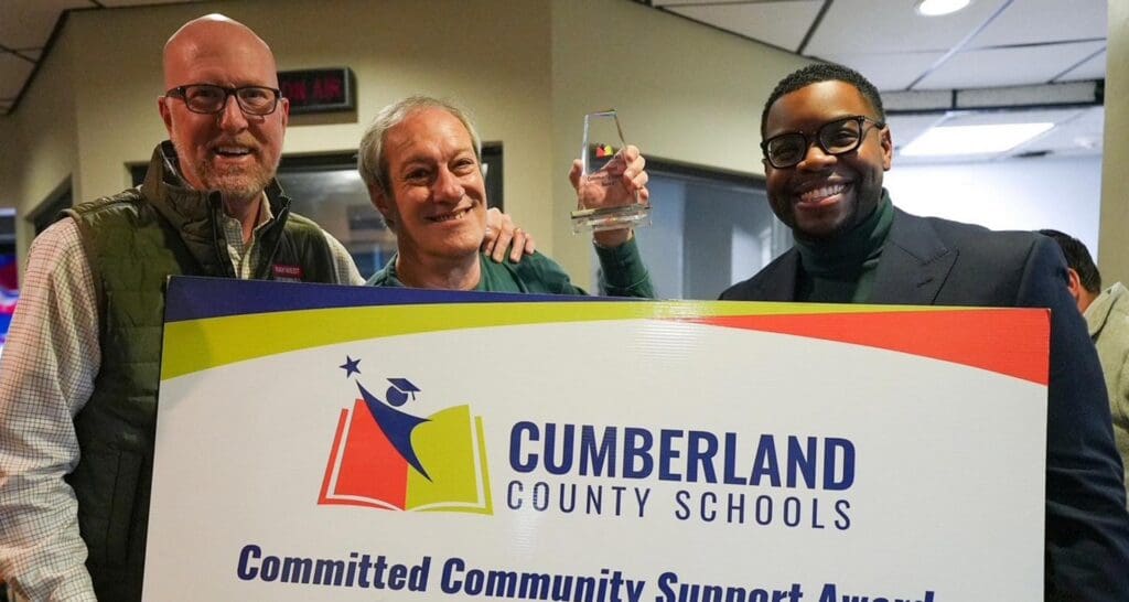 Greg West helping to present and award for Cumberland County Schools.